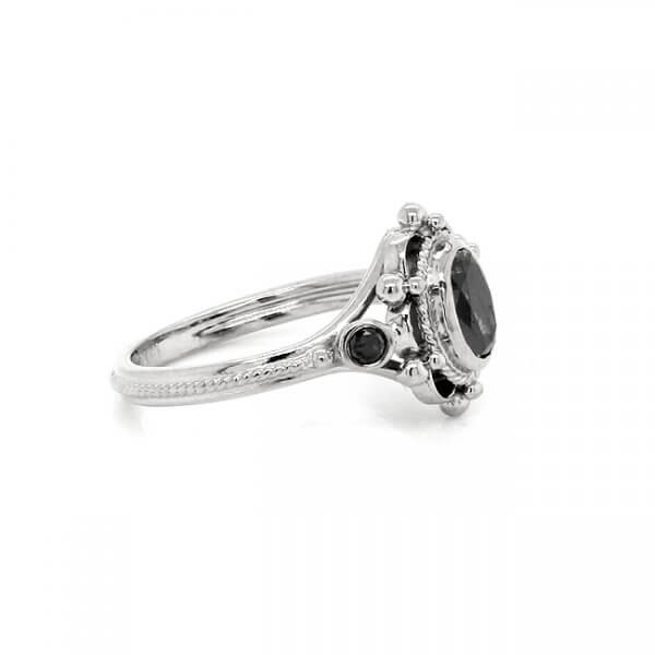 Antique style engagement ring with bezel black diamond