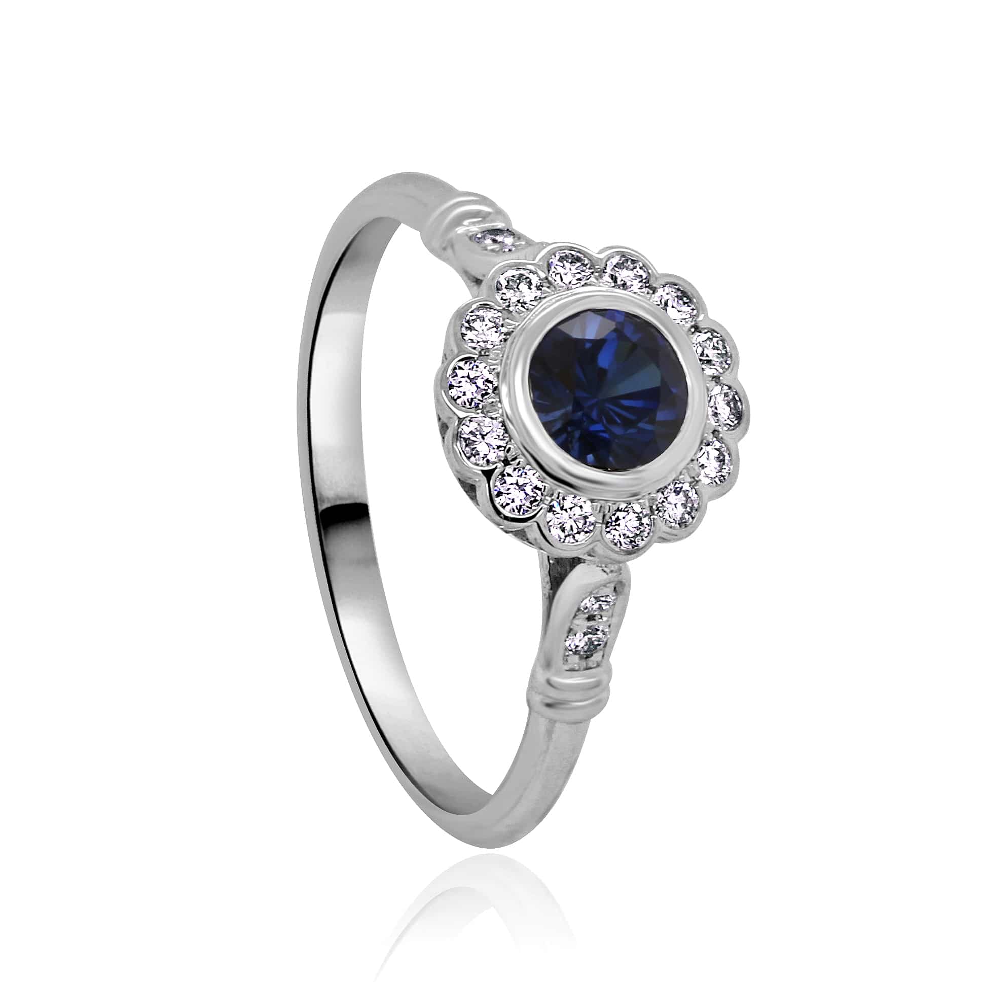 Edwardian sapphire diamond ring featuring a deep blue sapphire center stone, accented by delicate diamond details in an intricately designed vintage setting | OroSpot | Chicago, Illinois