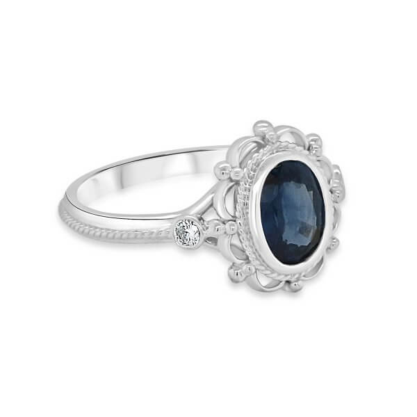 Oval sapphire in bezel Victorian style engagement ring