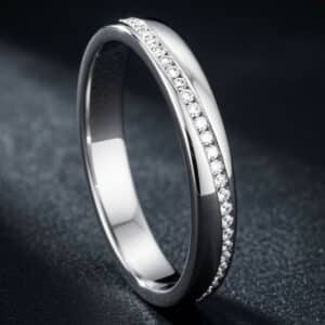 14K white gold eternity wedding band featuring channel-set round diamonds encircling the entire 3mm band.