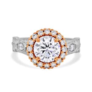 Vintage inspired diamond ring with hand engraving and round center stone in antique setting