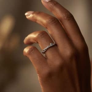 14K gold twig wedding ring with bark texture and round burnish-set diamonds inspired by nature.