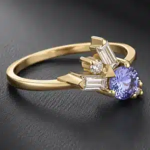 yellow gold tanzanite promise ring with two baguette moissanites and round diamond accents handcrafted in New York