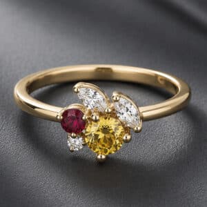 14K yellow gold cluster ring featuring a round yellow sapphire, ruby, marquise diamonds, and a round diamond.