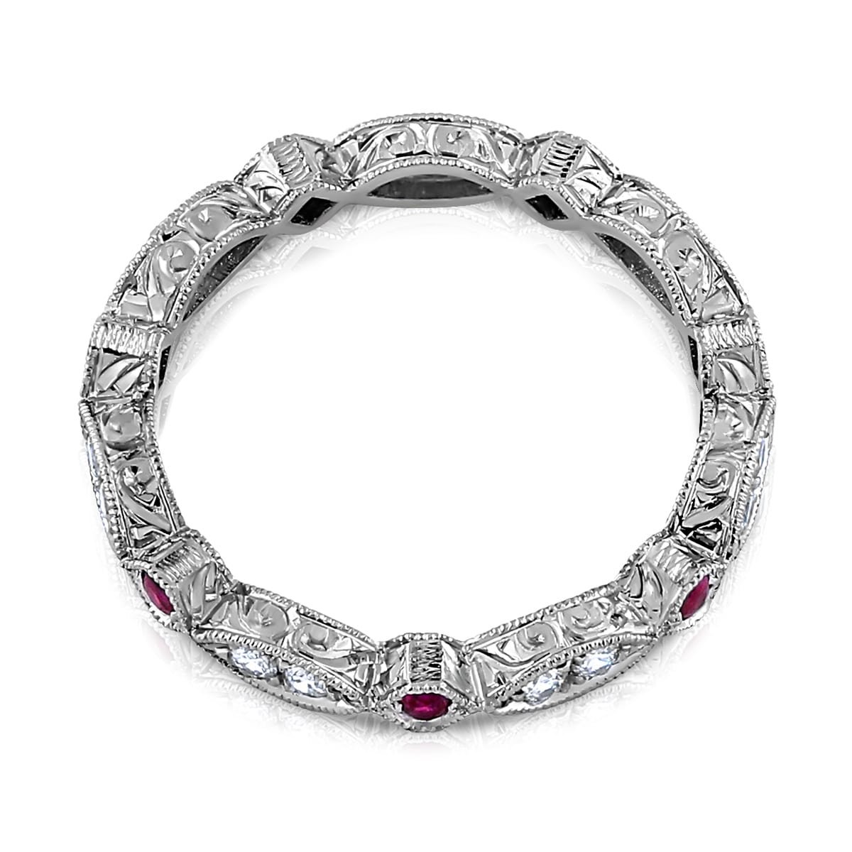 Vintage eternity band featuring alternating round diamonds and rubies set in a detailed milgrain gold band.
