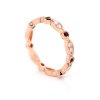 Elegant rose gold wedding band with diamonds and garnets