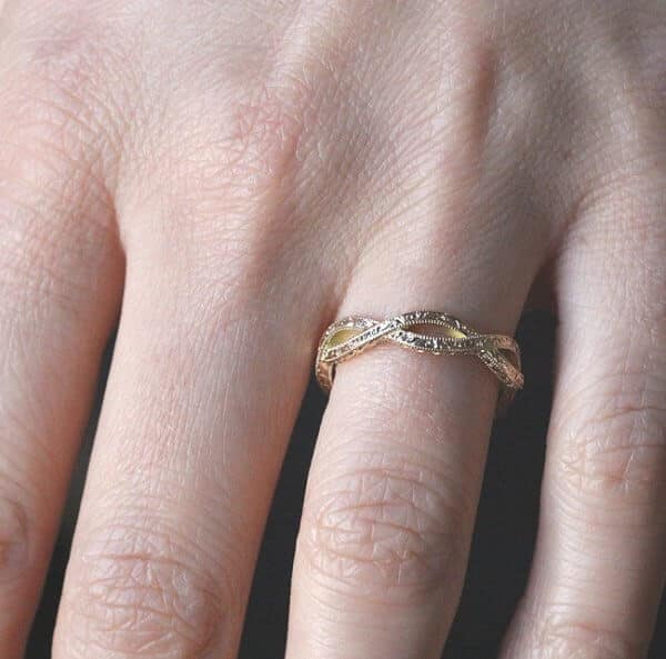 intertwined hand engraved gold wedding ring