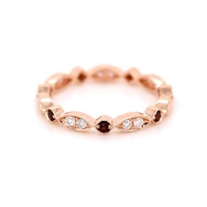 Modern Diamond and garnet eternity ring