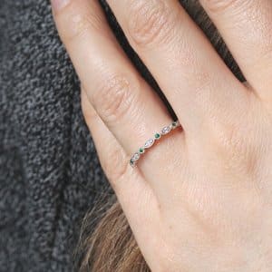 Modern green emerald and diamond eternity band