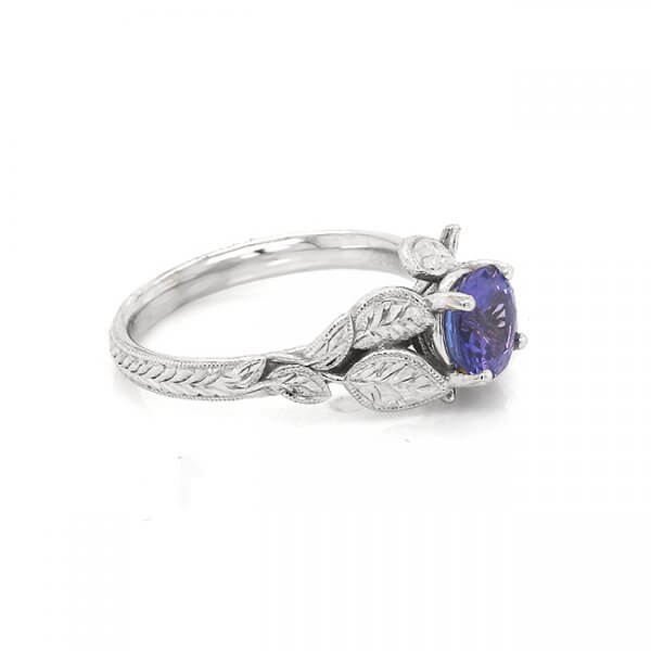 Tanzanite engagement ring with hand engraved leaves in organic design