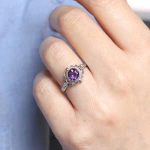bezel non traditional engagement ring with amethyst and side diamonds OroSpot