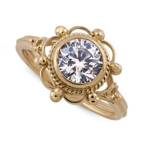 Bezel-set vintage diamond engagement ring with filigree details in 14K yellow gold by OroSpot