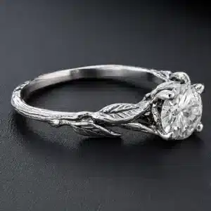 Botanical engagement ring with a certified lab-grown diamond, vine-inspired details, and handcrafted leaf accents.