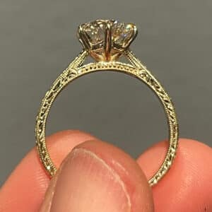 Cathedral six prong diamond ring in yellow gold with hand engraved wheat pattern and milgrain edges, vintage inspired solitaire design.