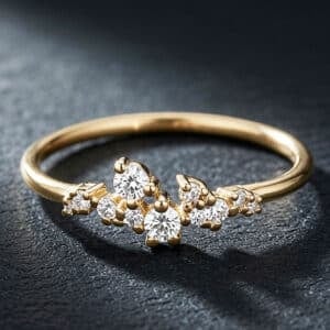 Petite diamond cluster promise ring in 14K yellow gold featuring eleven prong-set diamonds and a delicate band.