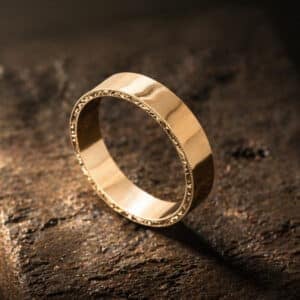 elegant vintage groom wedding band with hand engraved sides and high polished finish by orospot