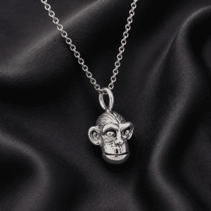 14K white gold monkey head charm pendant with detailed sculpted features and matching chain handcrafted by OroSpot.