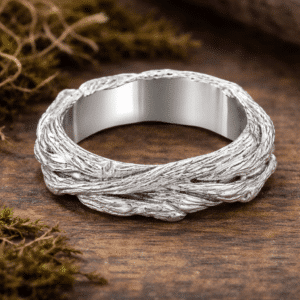 Gold tree bark wedding band with organic branch texture and sculpted natural design, handcrafted with rugged surface detail and smooth interior.