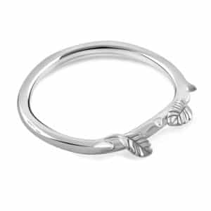 Minimalist 14K gold curved wedding band with engraved leaf design, nature-inspired style.
