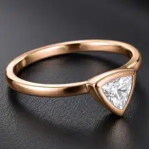 minimalist rose gold engagement ring with a trillion-cut lab-grown diamond in a sleek bezel setting handcrafted in New York City