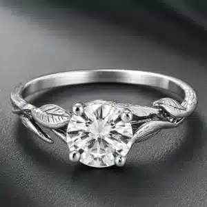Nature-inspired engagement ring with a 1.25ct lab-grown diamond, sculpted leaves, and organic branch details in white gold.
