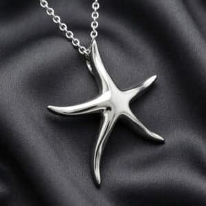 Ocean-inspired starfish pendant crafted in solid gold with hidden bail and elegant beach-inspired design by OroSpot.