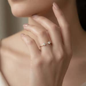 Modern open diamond ring shown on the hand to highlight its delicate profile and everyday versatility.