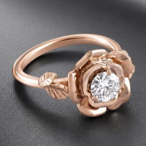 Rose flower diamond engagement ring featuring a 0.50ct lab-grown diamond surrounded by hand-sculpted gold petals.