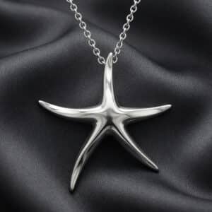 14K white gold starfish pendant necklace with hidden bail and matching gold chain handcrafted by OroSpot.