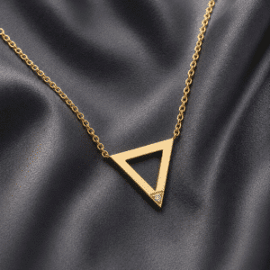 Minimalist triangle pendant necklace in 14K yellow gold with delicate diamond accent handcrafted by OroSpot.