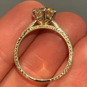 Vintage cathedral six-prong diamond engagement ring in 14k yellow gold featuring hand-engraved wheat pattern, milgrain edges, and classic antique-inspired design.