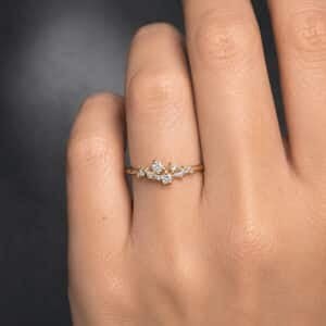 Delicate yellow gold promise ring featuring a sparkling cluster of natural diamonds in a feminine vintage-inspired design.