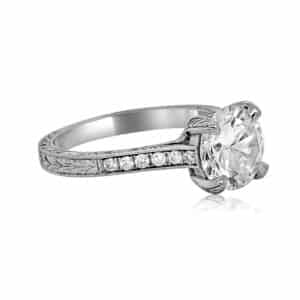 Antique-style 2ct diamond ring with hand-engraved platinum band and milgrain details.