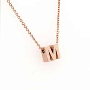 M Block initial charm OroSpot