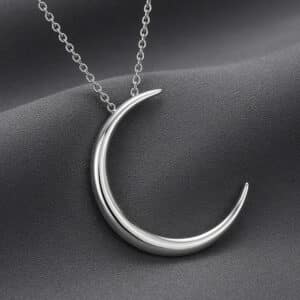 Crescent moon pendant in solid 14K gold with symbolic celestial design by OroSpot.