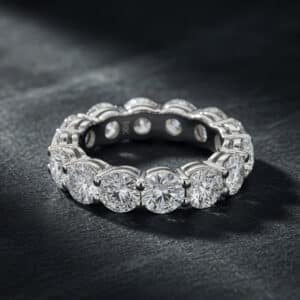 Wide 14K white gold eternity ring with round lab-grown diamonds set in shared prongs.