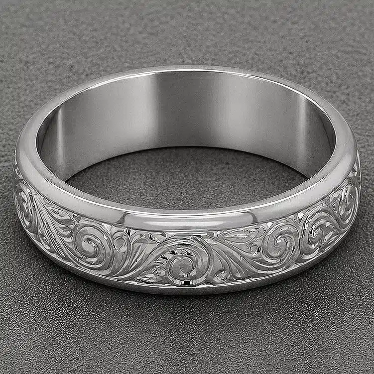 close up of art nouveau mens ring showing hand engraved scrollwork and milgrain edges in high polish finish by orospot