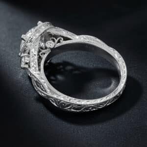 White gold halo engagement ring with hand engraving, milgrain edges, pavé diamonds, and a round lab-grown diamond center stone.