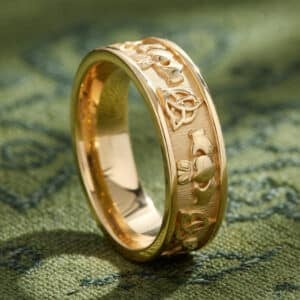 Claddagh men’s wedding ring in gold with heart hands and crown symbols textured finish OroSpot
