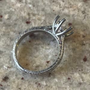 Vintage solitaire ring setting in hand engraved 14K white gold with six prong mounting, wheat pattern engraving and milgrain edges.