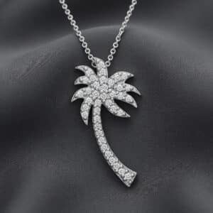 Diamond palm tree pendant in solid gold symbolizing resilience, peace, and paradise by OroSpot.