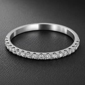 Slim 1.8mm diamond wedding band featuring 19 round brilliant diamonds in a cut-down micro-pavé setting crafted in 14K white gold.