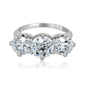 side profile of edwardian vintage 3 stone engagement ring showing hand engraved scroll details, milgrain edges, and lab grown diamonds in platinum or 14k gold, crafted by orospot