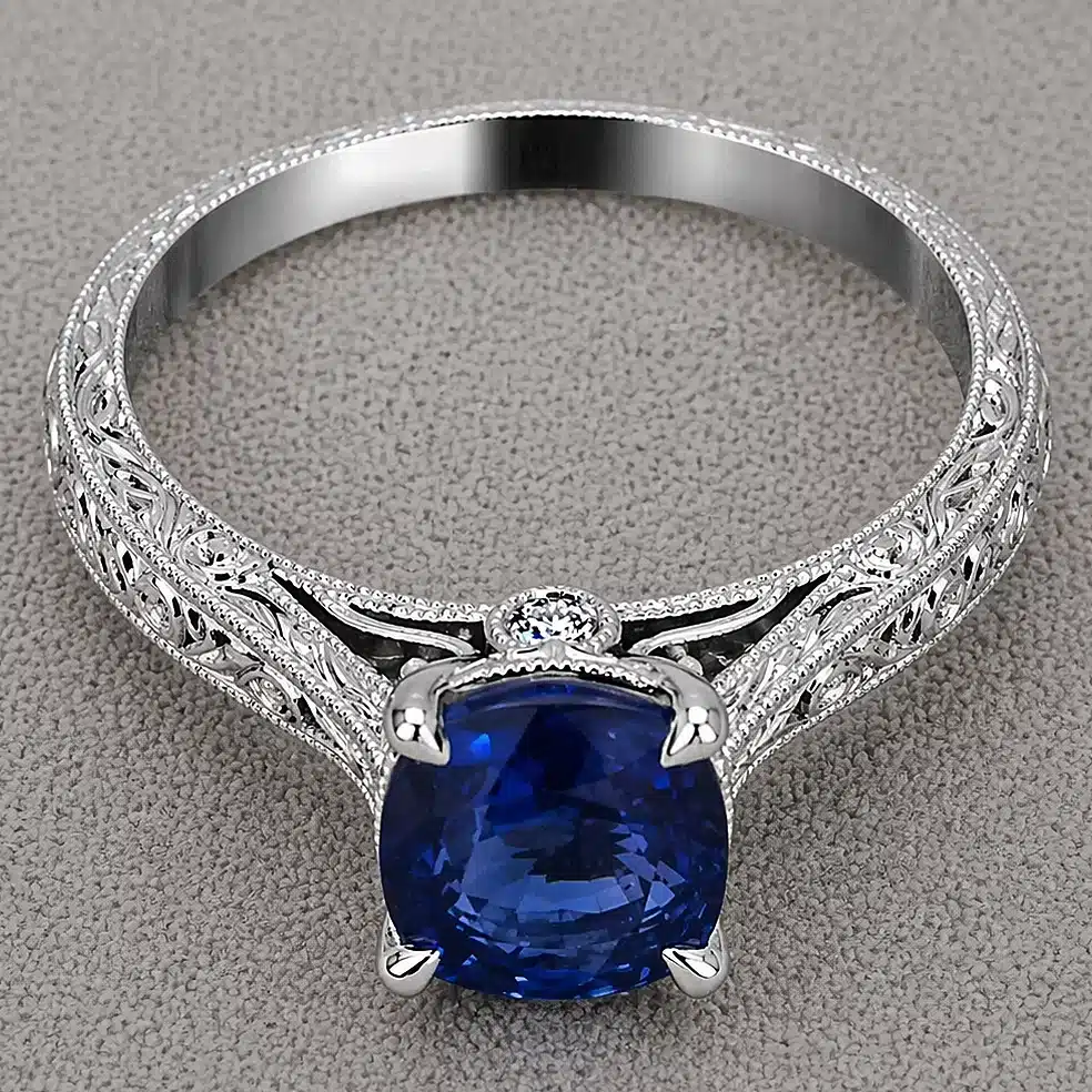 antique cushion cut blue sapphire engagement ring 1.51ct natural sapphire peekaboo diamonds hand engraved milgrain 14k white gold orospot