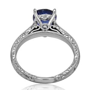 Hand-engraved antique sapphire engagement ring with cushion-cut 1.51ct blue sapphire and vintage filigree details in 14K white gold.