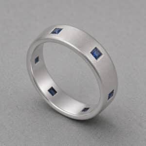 princess sapphire mens wedding band white gold channel set square sapphires satin finish orospot