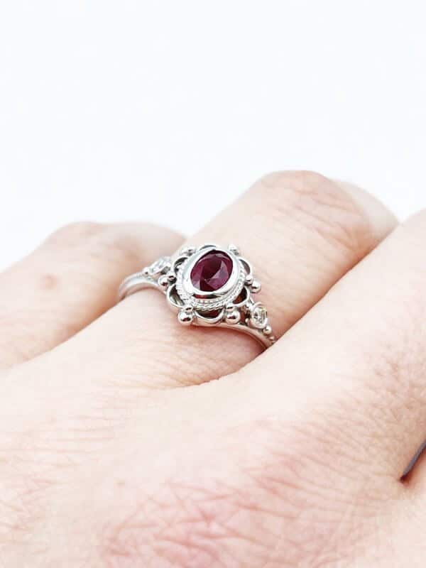 Ruby bezel set ring with diamond