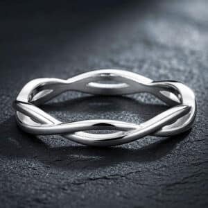 Women's braided wedding band featuring an intertwined love knot design in solid 14K white gold.