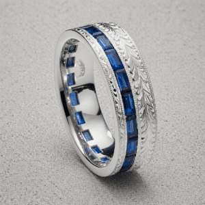 antique style mens wedding band with baguette blue sapphires channel set in 14k white gold with hand engraving and milgrain edges by orospot