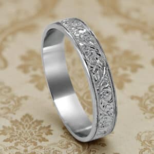 Art Nouveau men’s wedding band in white gold with hand engraved scrollwork and milgrain edges OroSpot